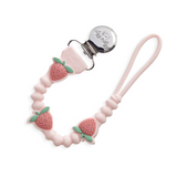 Itzy Ritzy 705101560 Attache-suce en silicone - Sweetie Strap Plus™ - Itzy Ritzy Fraise vendu par Veille sur toi
