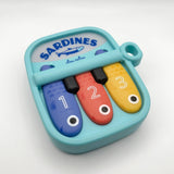 Itzy Ritzy Canada 403802018 *NEW* Bitzy Tunes™ Light-up Interactive Piano Toy - Sardines vendu par Veille sur toi