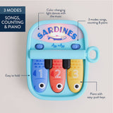 Itzy Ritzy Canada 403802018 *NEW* Bitzy Tunes™ Light-up Interactive Piano Toy - Sardines vendu par Veille sur toi